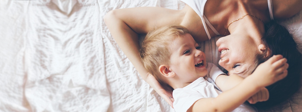 Mother and child on bed